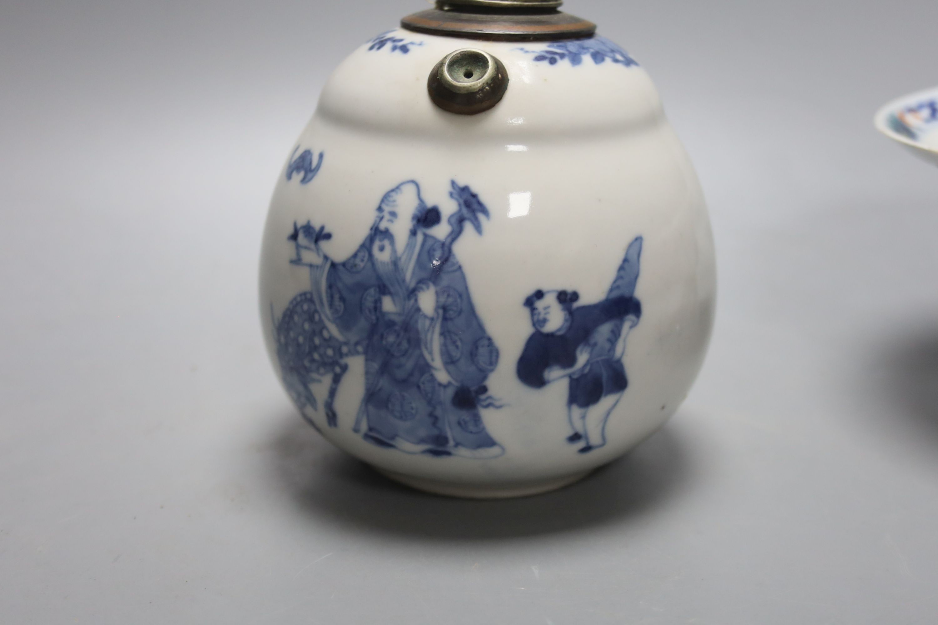 A Chinese blue and white water pipe vessel, a doucai stem dish and a Japanese Imari bowl, 19th century, (3)